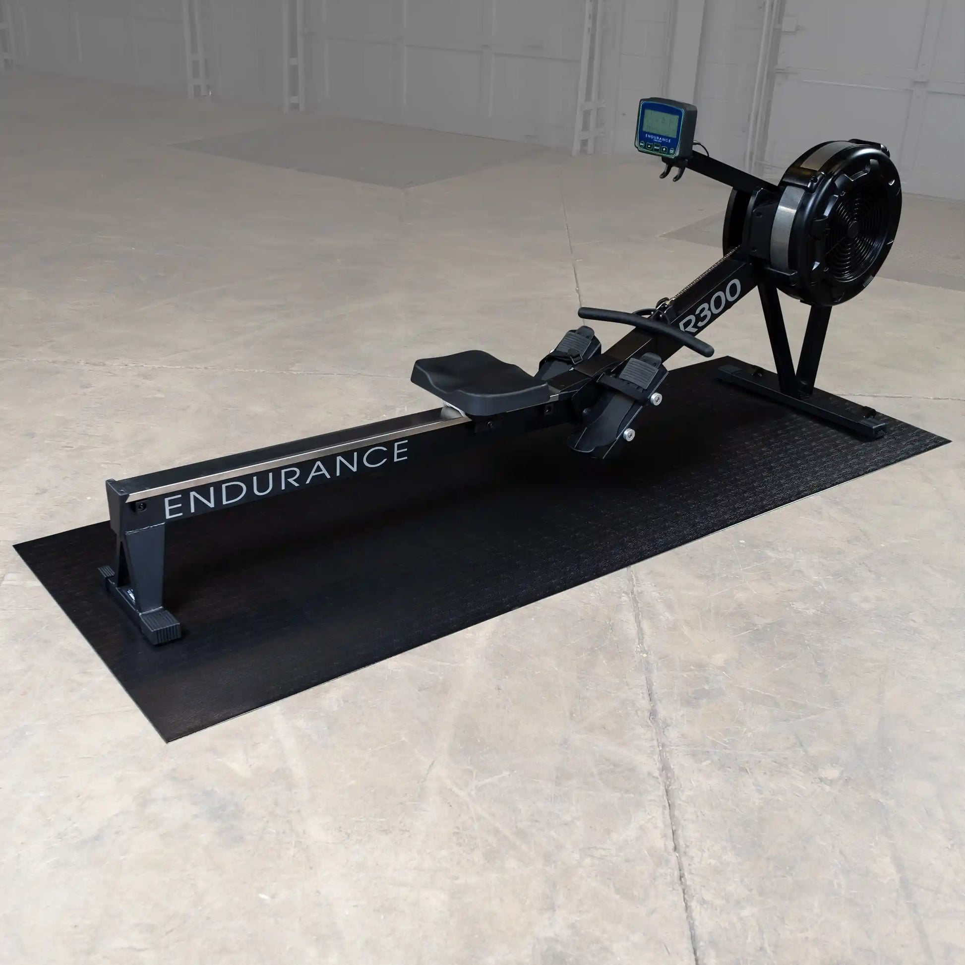 Endurance R300 rowing machine in black on a mat, featuring an LCD monitor.