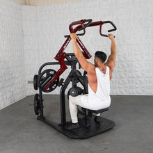 Man using a Marbo Sport seated row machine with red handles for strength training.