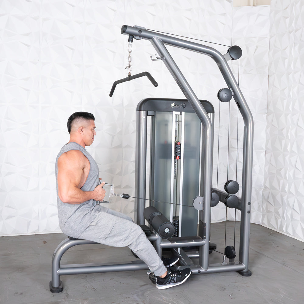 Man using a cable machine for strength training, featuring a sleek gray design and adjustable weight.