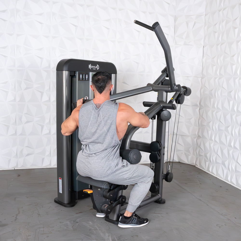 Man using Muscle D lat pulldown machine in gray gym outfit.