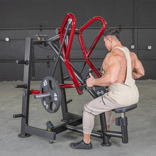 Man using a red Body-Solid lever gym machine for back exercises.