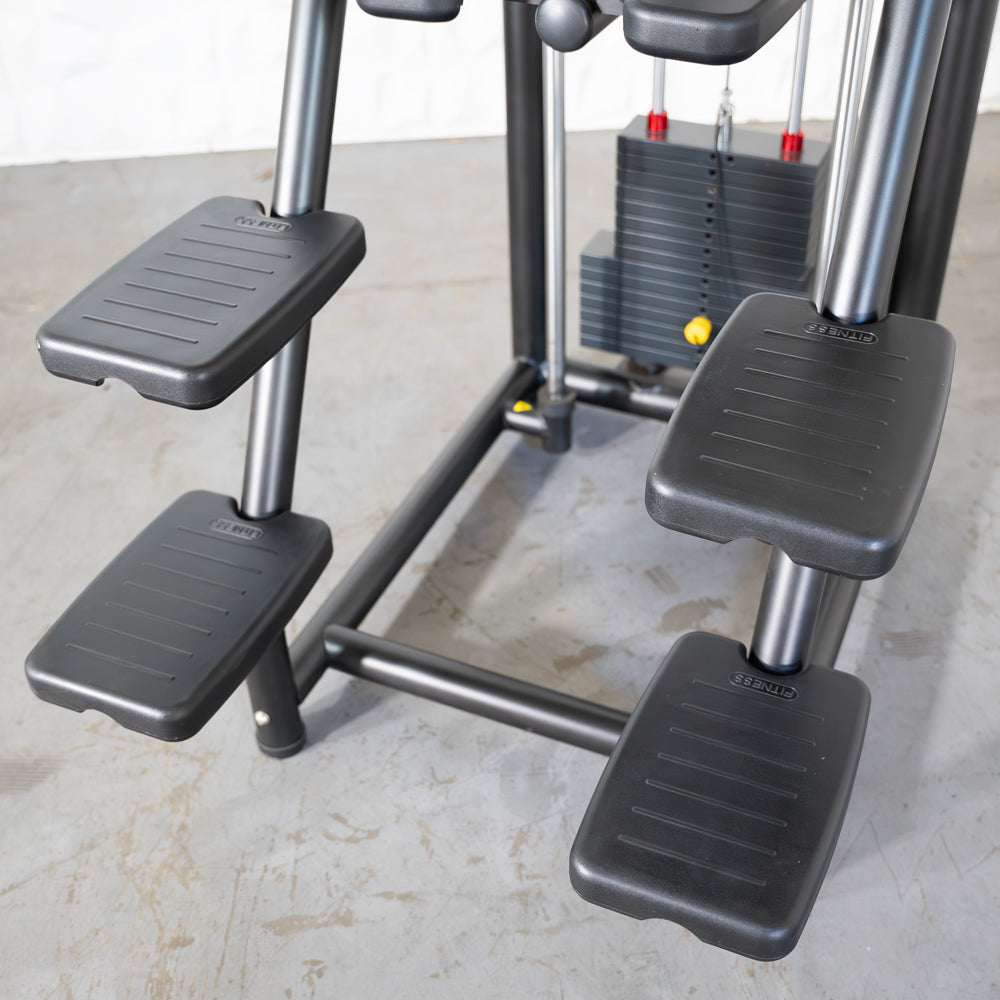 Gym equipment with black footplates and weight stack, ideal for strength training.