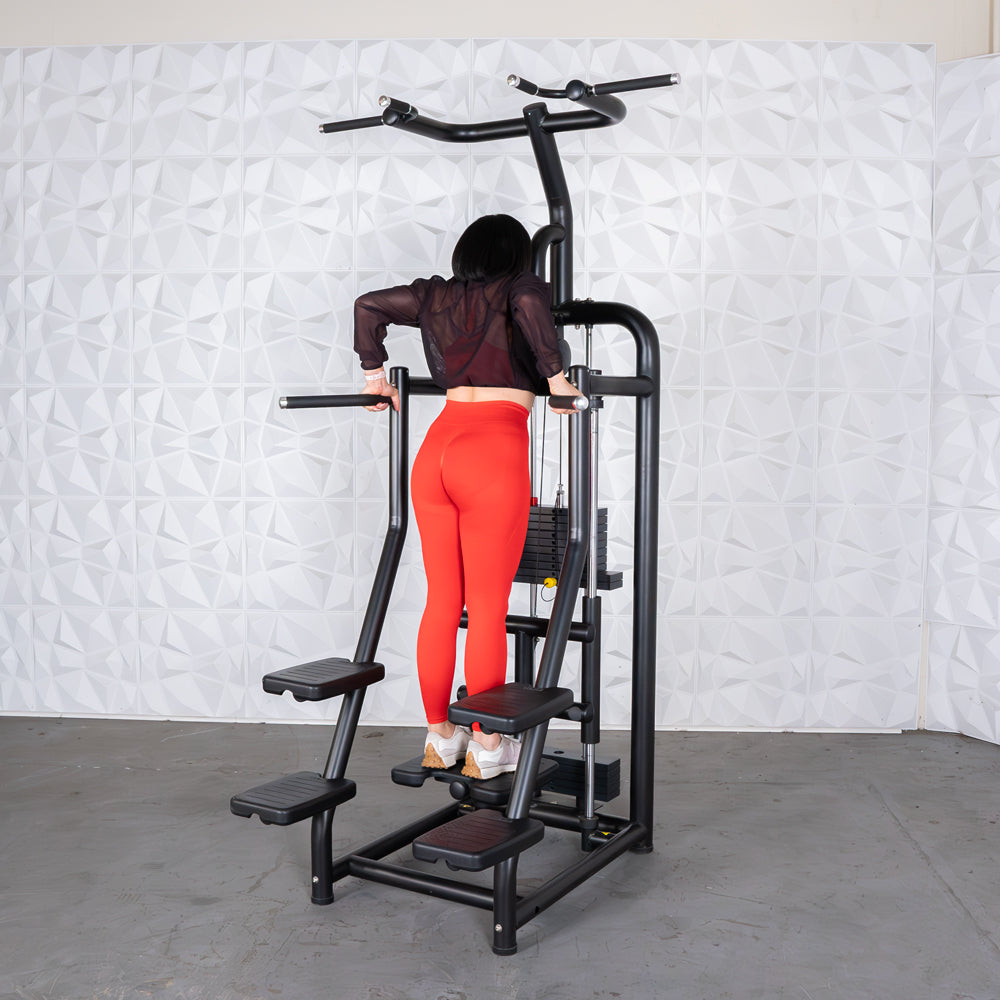 Woman using a vertical climber machine in red leggings for effective home workout.