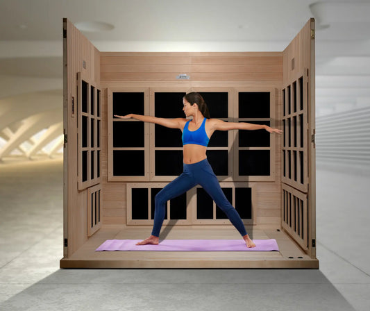 Woman in a yoga pose inside a wooden Golden Designs Catalonia infrared sauna cabin