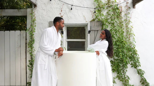 Athlete sitting in a cold plunge tub demonstrating ideal ice bath duration