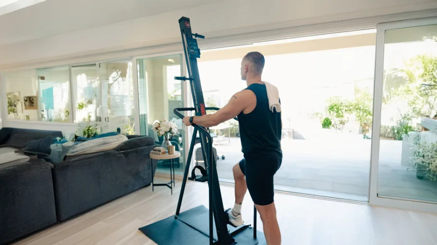 Athlete using a VersaClimber for a full-body vertical climbing workout