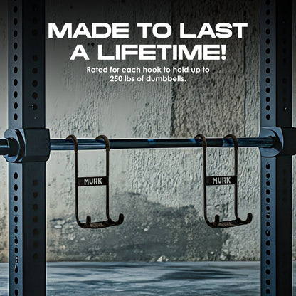 Two hooks labeled “MVRK” on a squat rack in a gym setting.