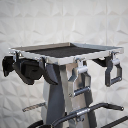 Gym accessory rack with handles on a weight machine.