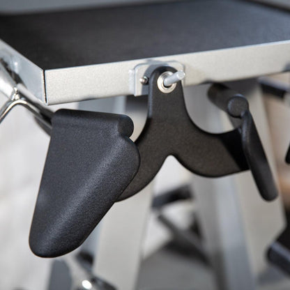 Accessory rack with black lever handles on a metal frame.