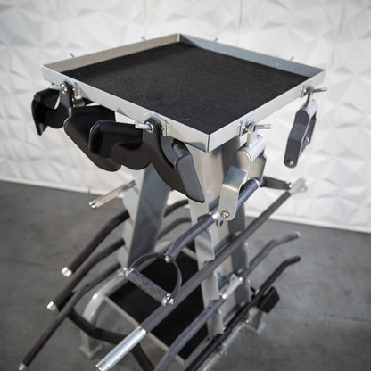 Metal accessory rack with multiple clamps and a black top tray.