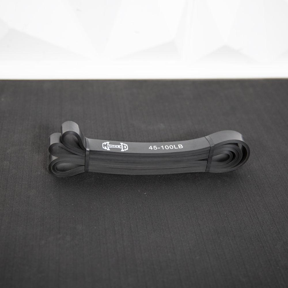 Set of black resistance bands looped together, labeled 45-100 lb.