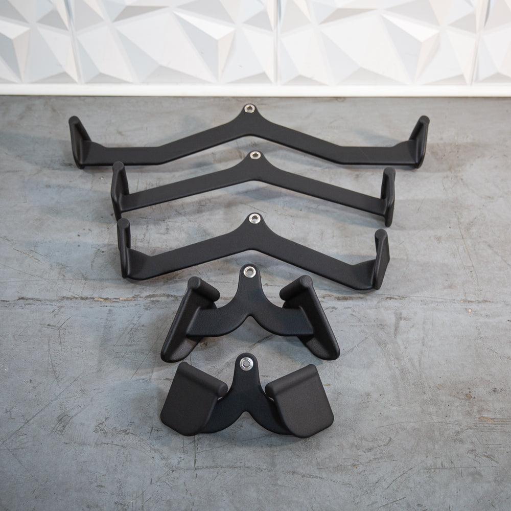 Set of black metal decorative handles and brackets arranged in a line.