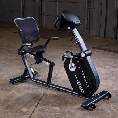 Endurance B4R recumbent bike with mesh backrest in a gym setting.
