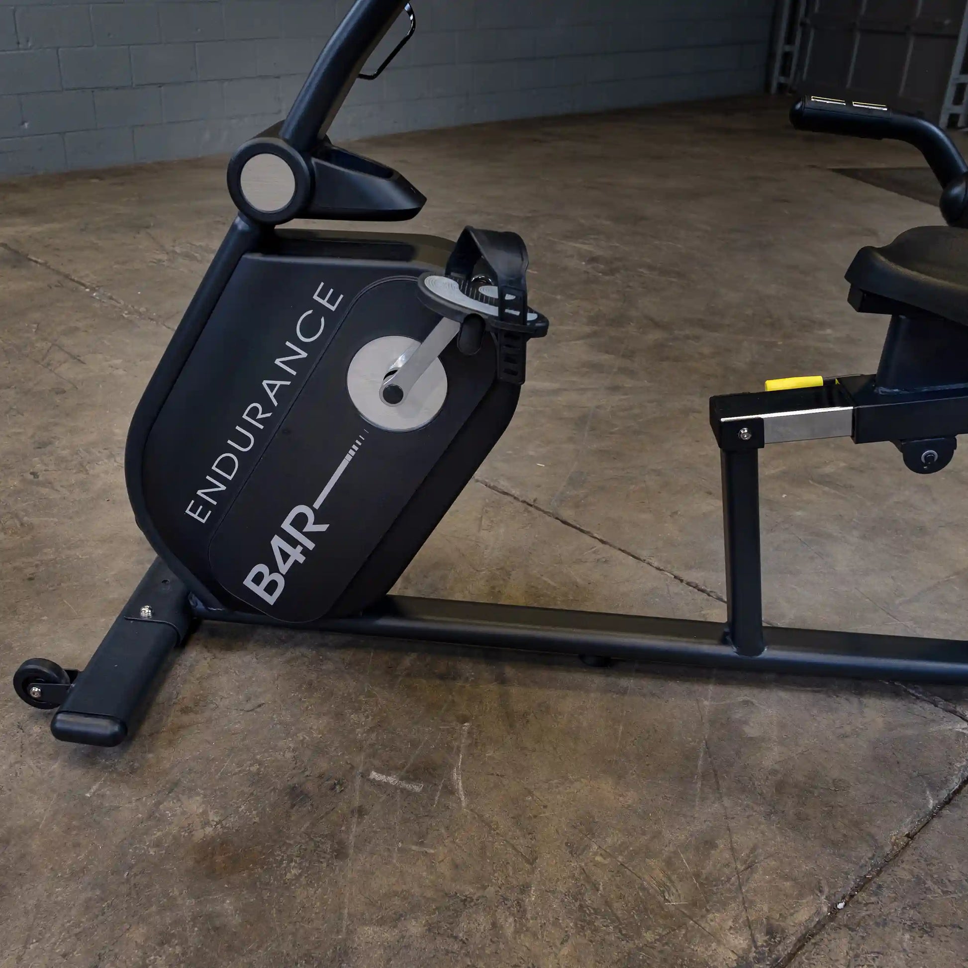 Endurance B4R exercise bike in black with sturdy frame on concrete floor.