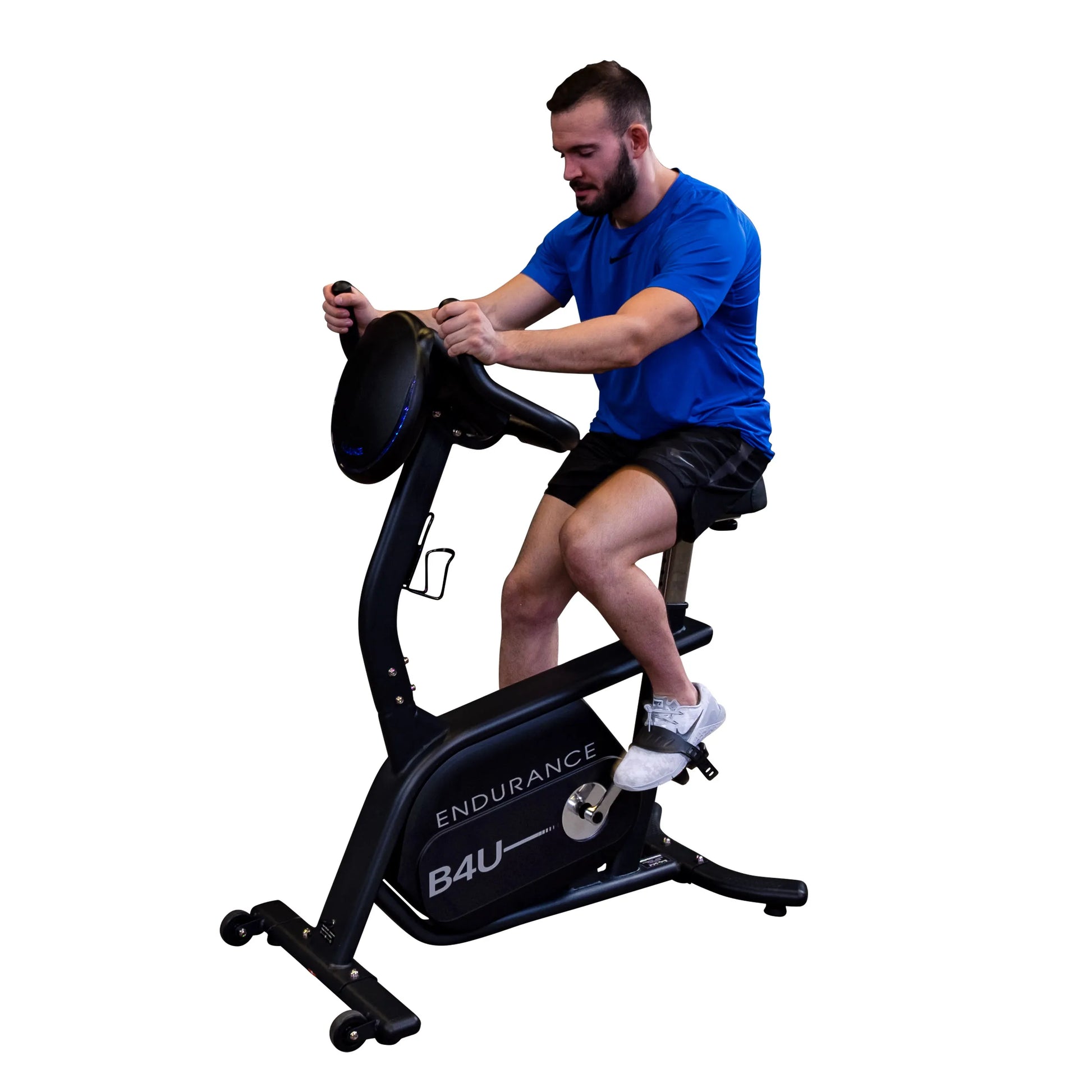 Man exercising on black Endurance B4U stationary bike, wearing blue shirt and black shorts.
