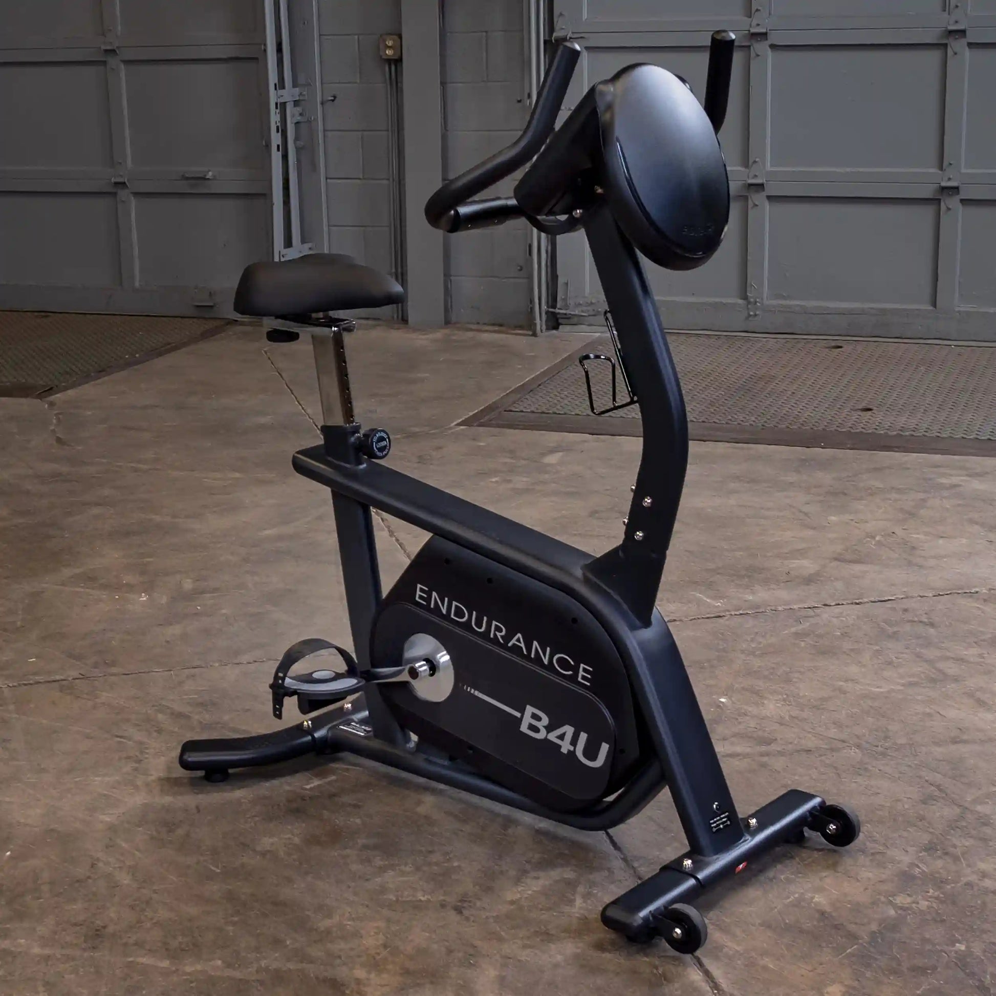 Endurance B4U exercise bike in a garage setting with adjustable seat and ergonomic handlebars.