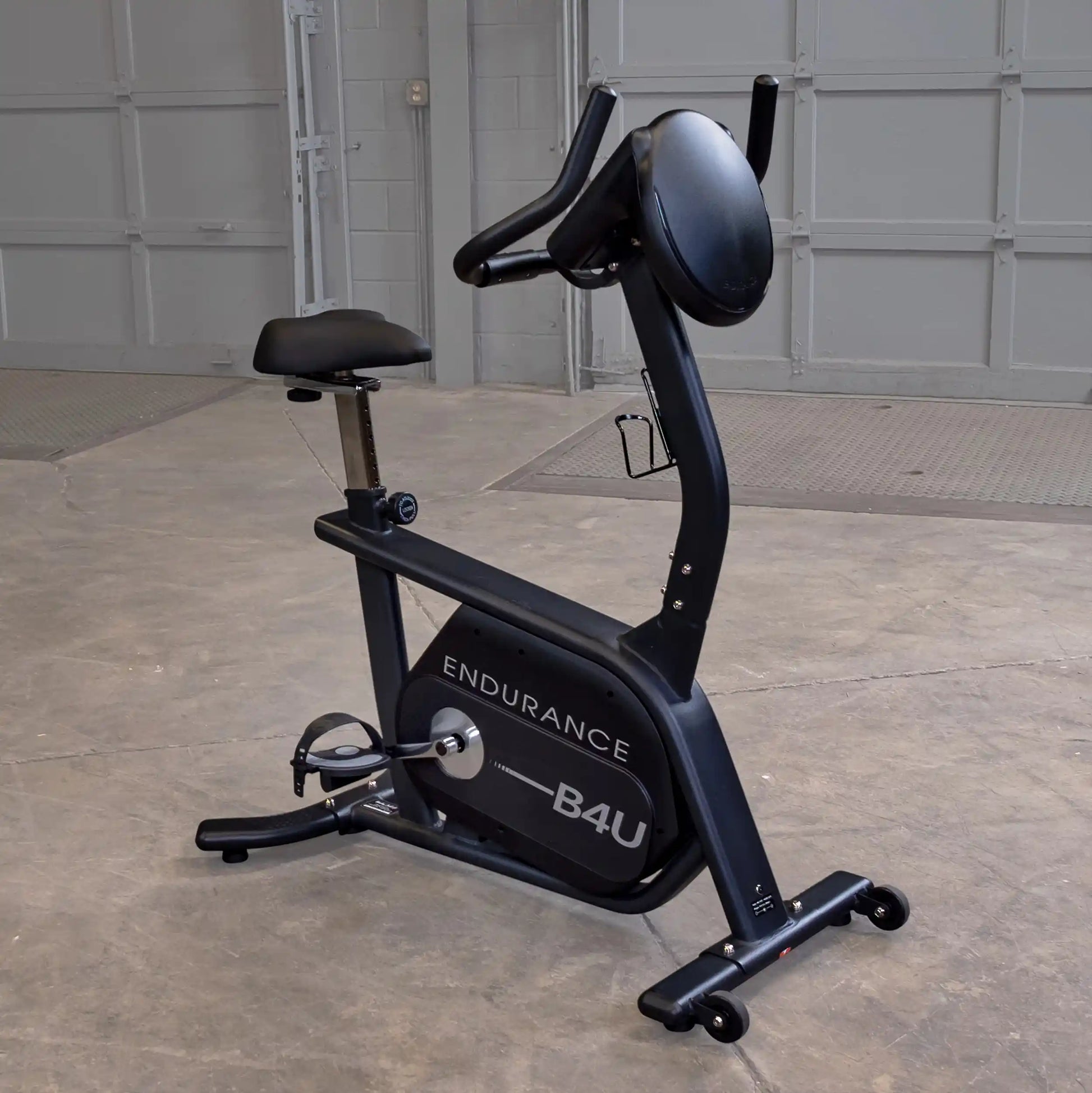 Endurance B4U exercise bike with black frame in a garage setting.
