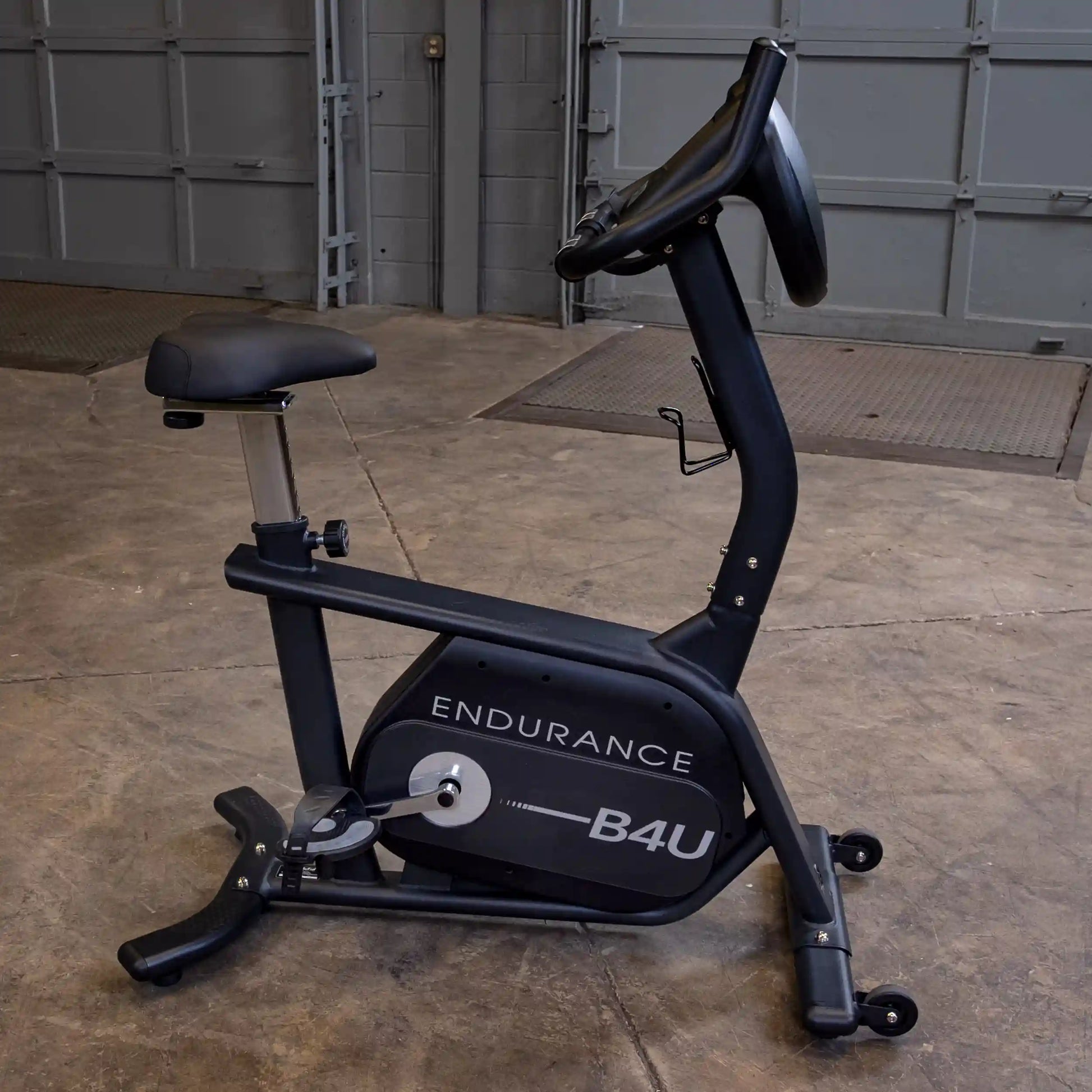 Endurance B4U exercise bike with black frame in a garage setting.