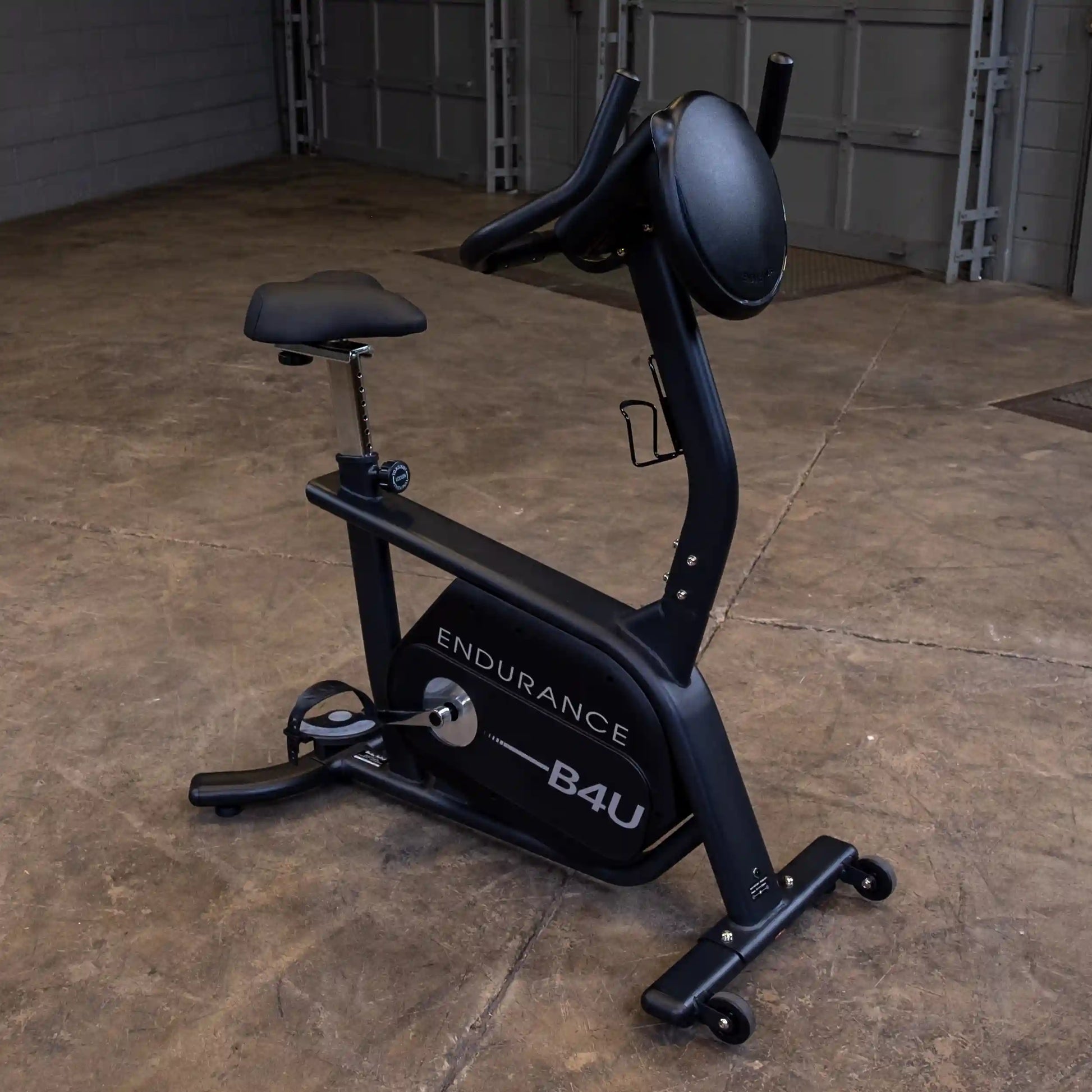 Endurance B4U exercise bike with adjustable seat in a garage setting.