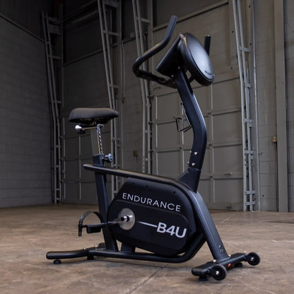 Endurance B4U stationary bike in a garage setting, featuring a sleek black design.