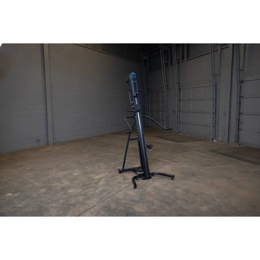 Hydrow Wave rowing machine in a spacious gray garage setting.