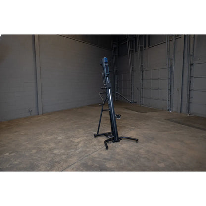 Hydrow Wave rowing machine in a spacious gray garage setting.