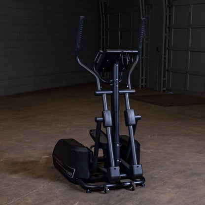 Endurance E300 elliptical trainer in a dimly lit garage.