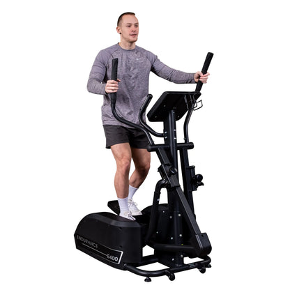 Man exercising on Endurance E400 elliptical trainer in black.