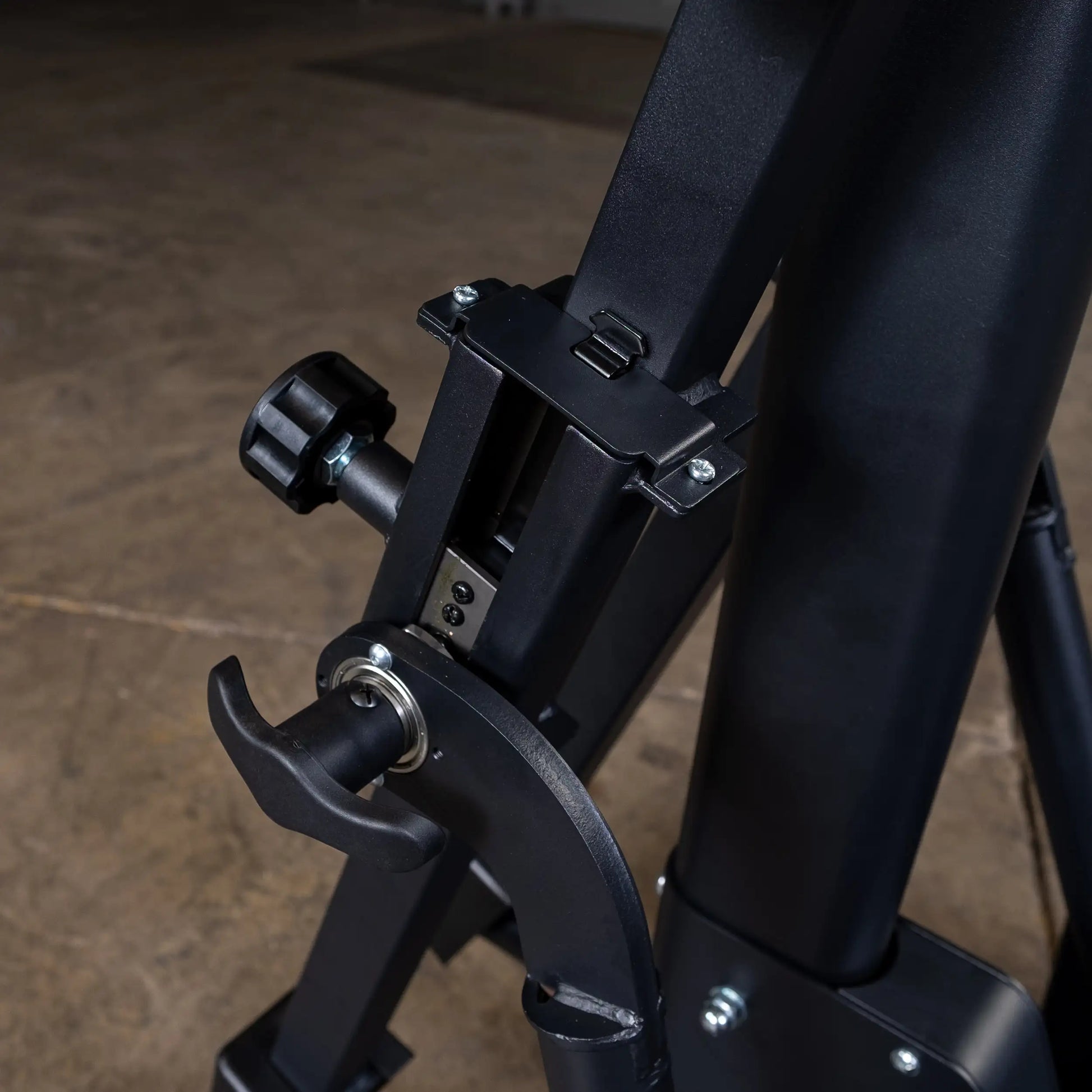 Adjustable black stand with a locking mechanism, ideal for heavy-duty equipment.