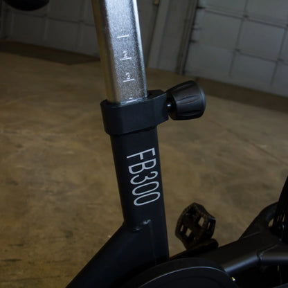 FB300 exercise bike seat adjustment knob with height markings.