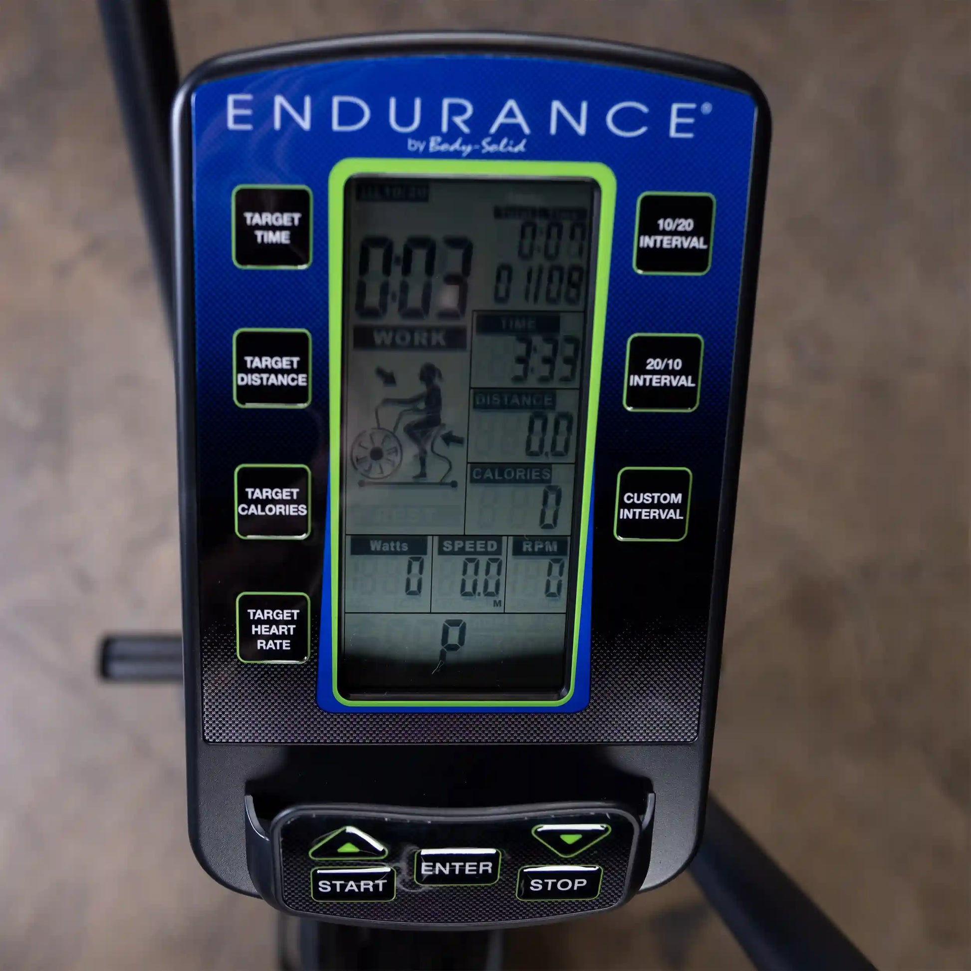 Endurance exercise bike console displaying time, distance, and calories with interval settings.