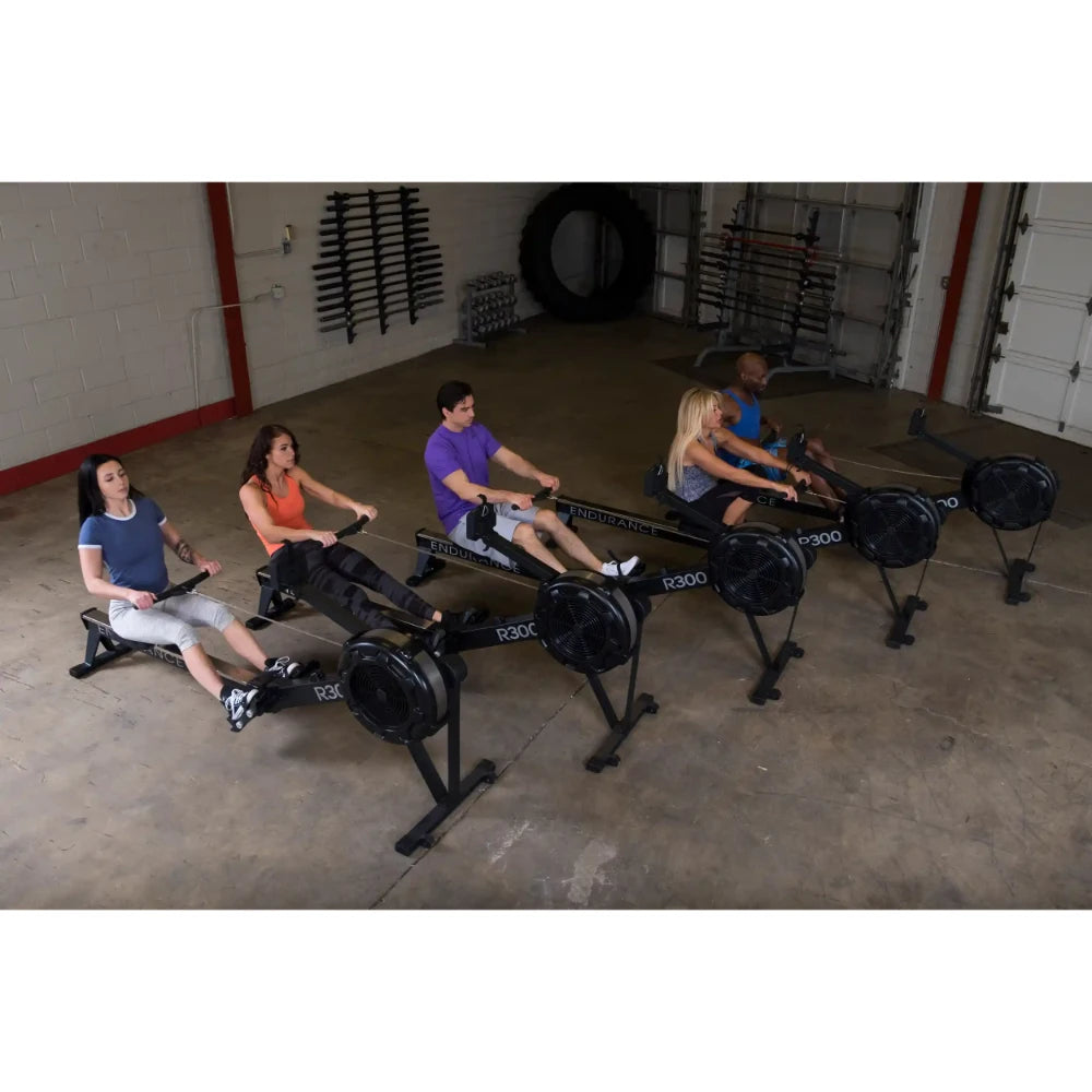 Group exercising on Endurance R300 rowing machines in a gym.