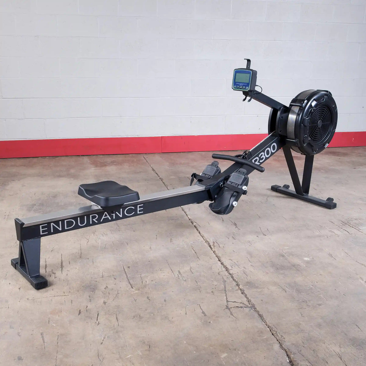 Endurance R300 rowing machine with digital display on a concrete floor.