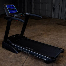 Endurance T25 treadmill with digital display in a dimly lit room.