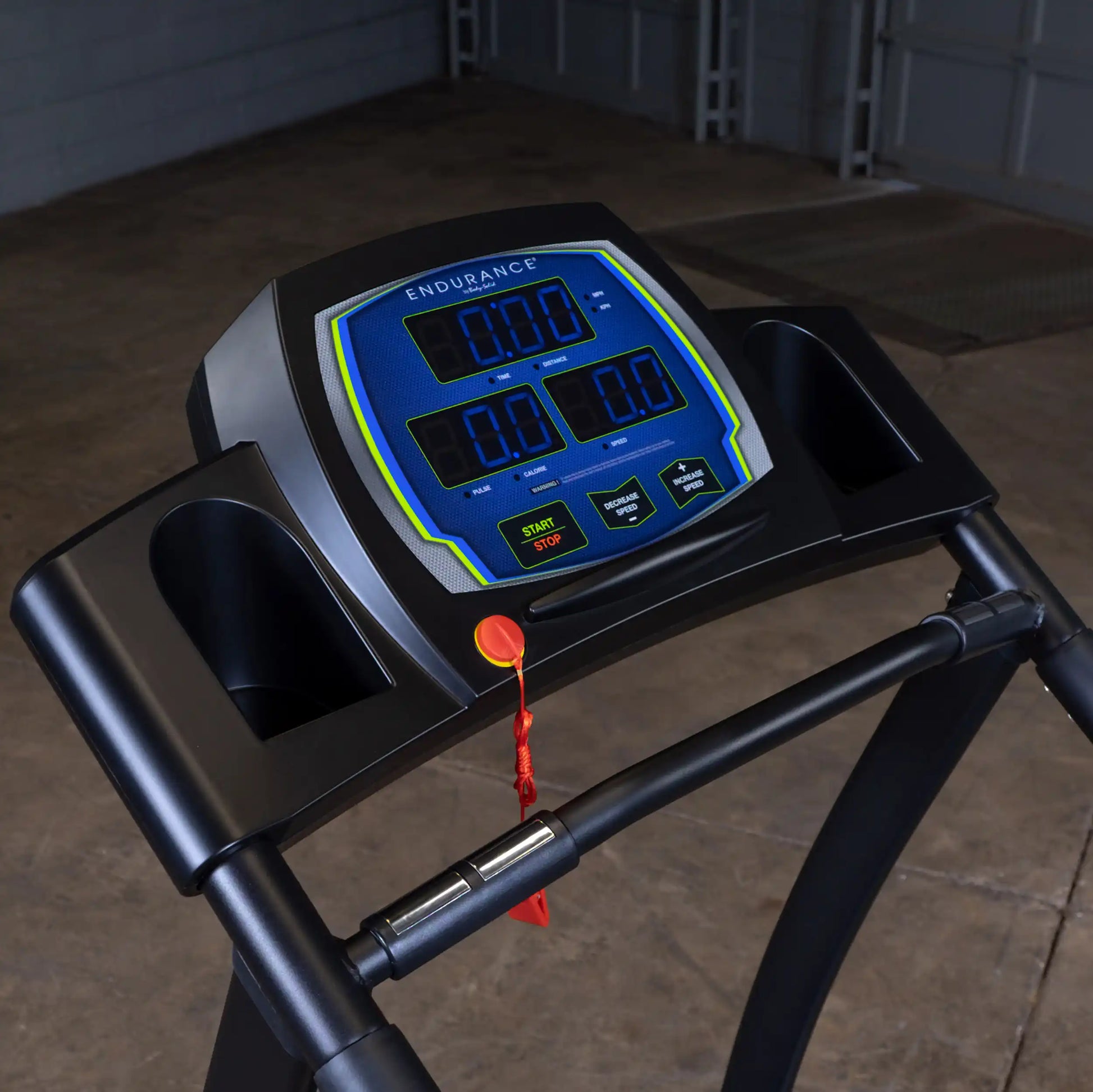 Endurance treadmill console with digital display and safety key in a black frame.
