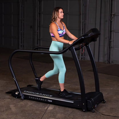 Woman exercising on Endurance T50 treadmill in colorful sportswear.