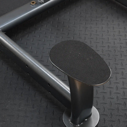 landmine platform with textured black grip on diamond plate flooring.