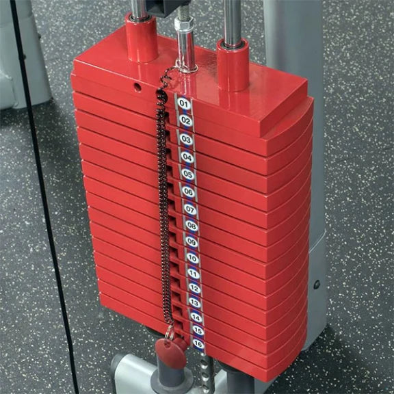 Red gym weight stack with numbered plates on a fitness machine.