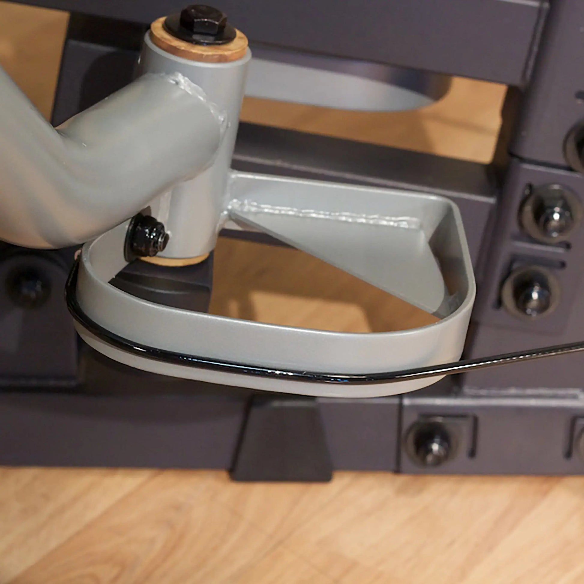 Grey metal pedal mechanism with bolt detail on NordicTrack rowing machine.
