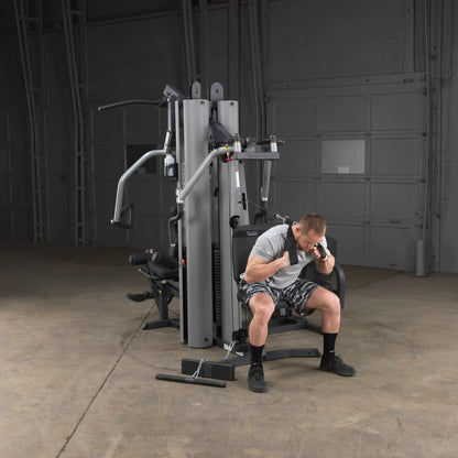 Man using Body-Solid G9S Home Gym in gray for strength training.