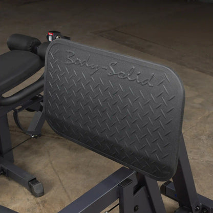 Body-Solid leg press machine with diamond-patterned footplate for enhanced grip.