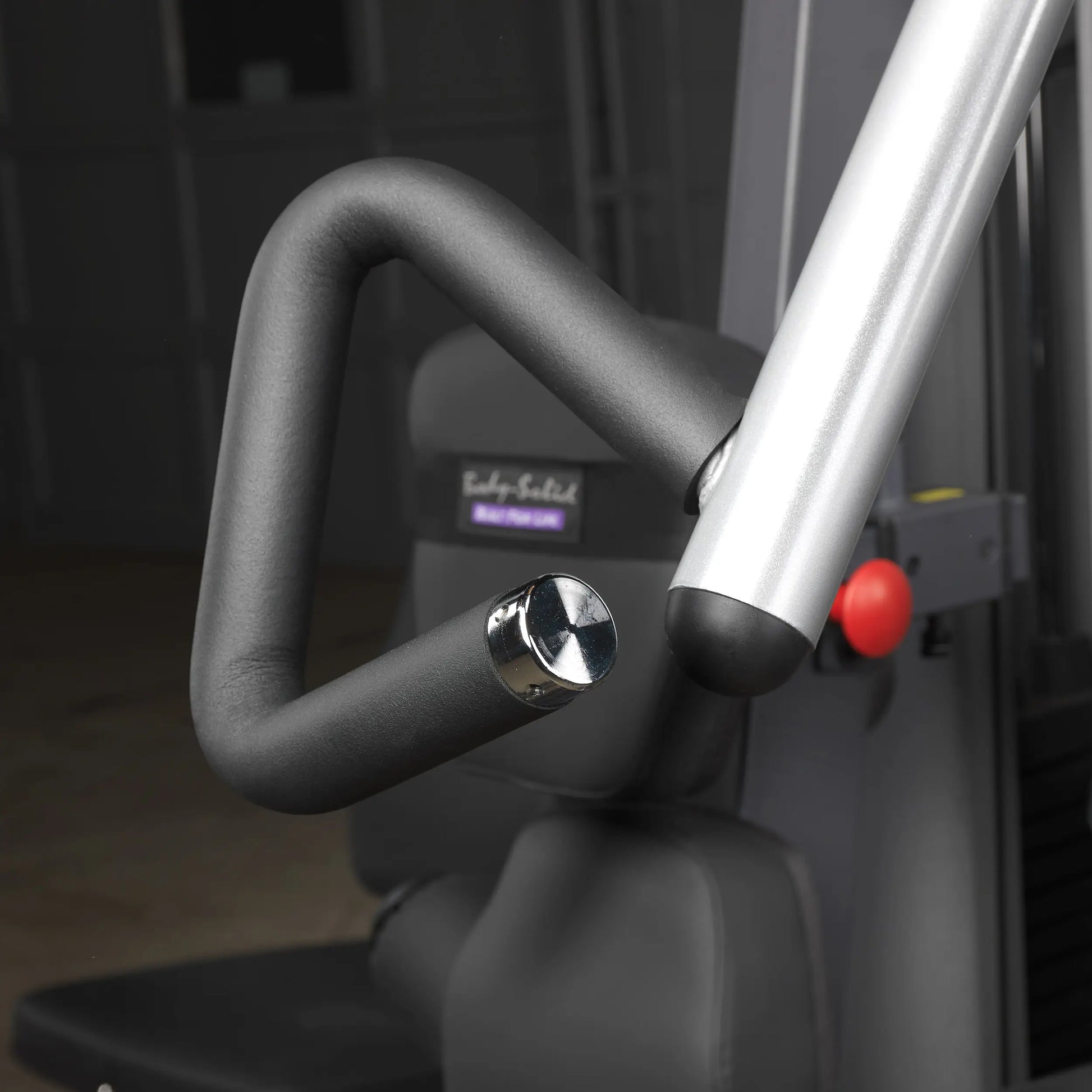 Body-Solid weight machine handle with black ergonomic grip.
