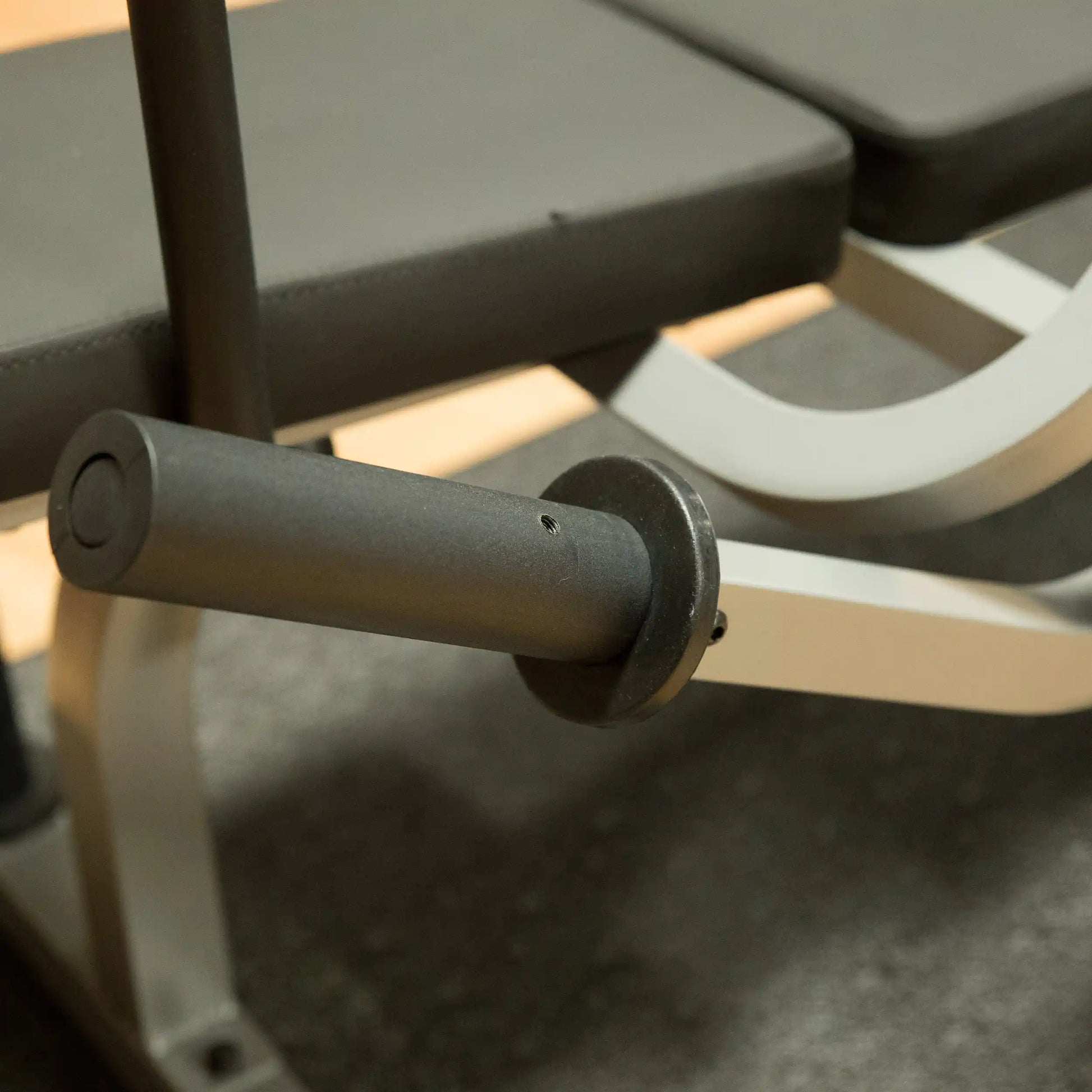 Adjustable weight bench with black padded seat and sturdy steel frame for home gym.