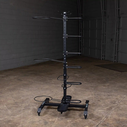 Vertical black bike rack with multiple hooks in a garage setting.