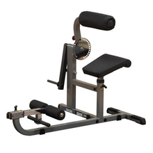 Body-Solid adjustable sissy squat machine with padded supports for leg workouts.