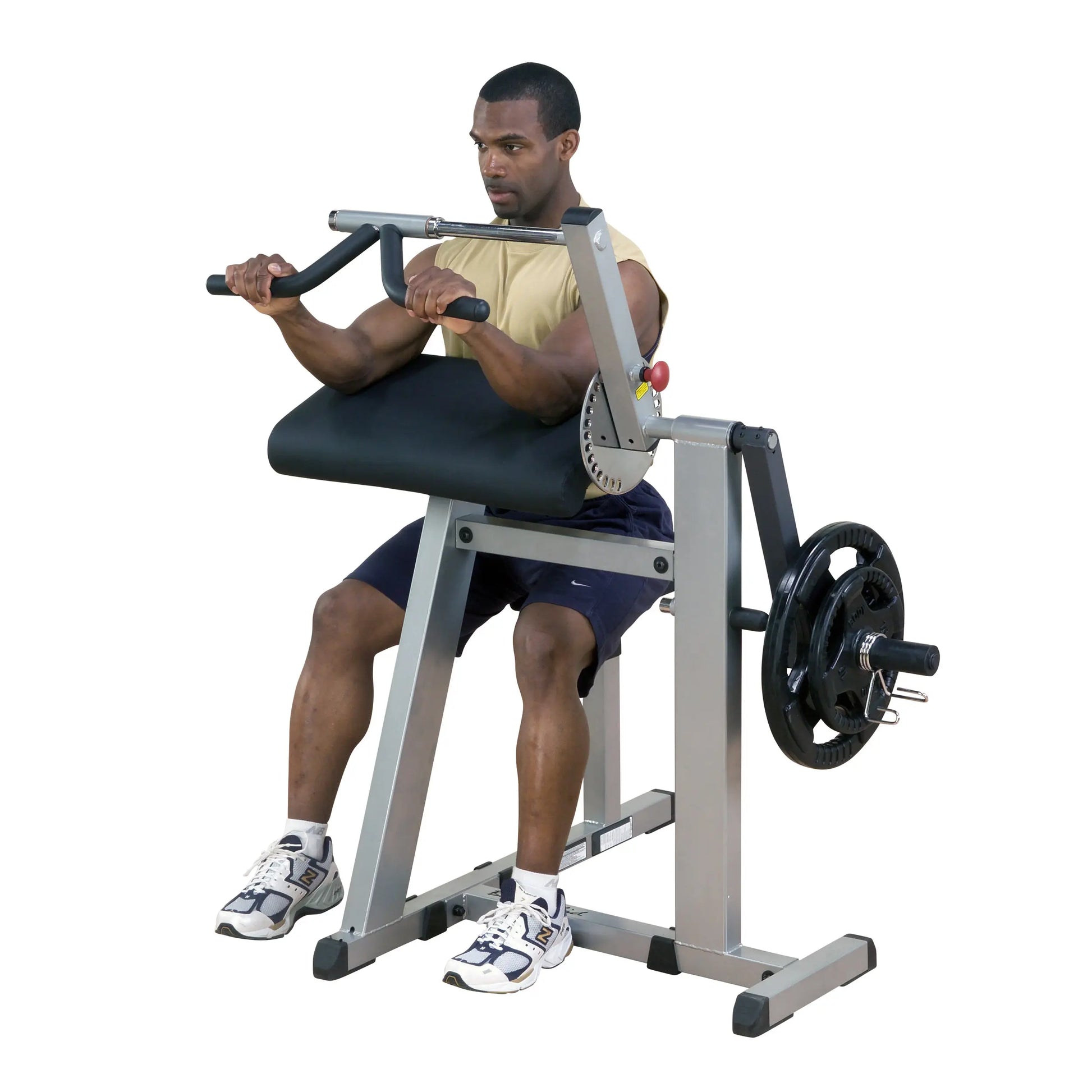 Man using seated preacher curl machine for arm workout.