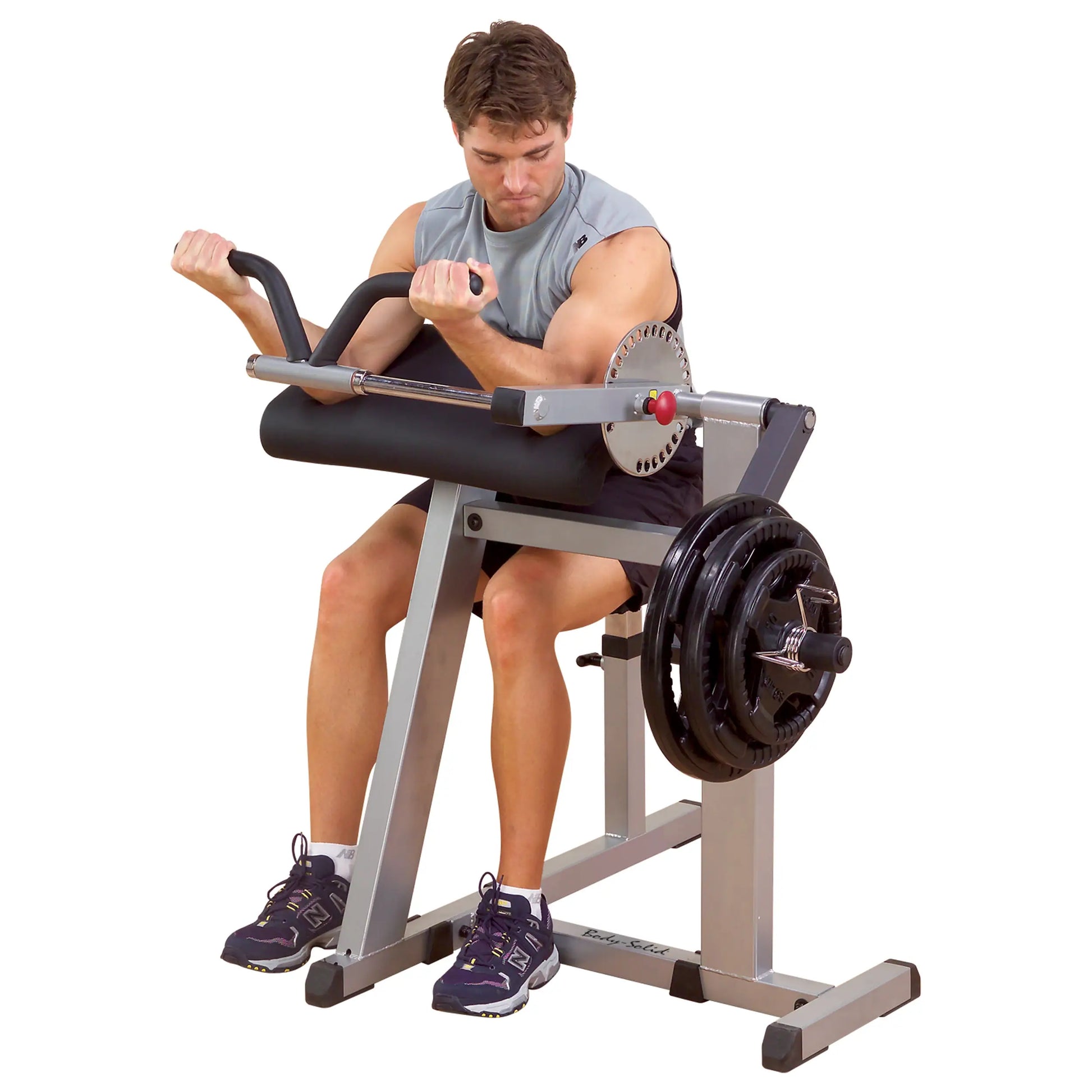 Man using Body-Solid preacher curl bench for arm workout, featuring weight plates.