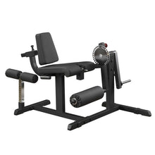 Black leg curl machine with adjustable padded seat for gym workouts.