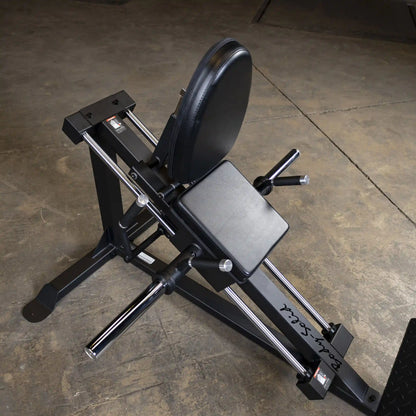 Body-Solid adjustable back extension bench with black cushioned seat for strength training.