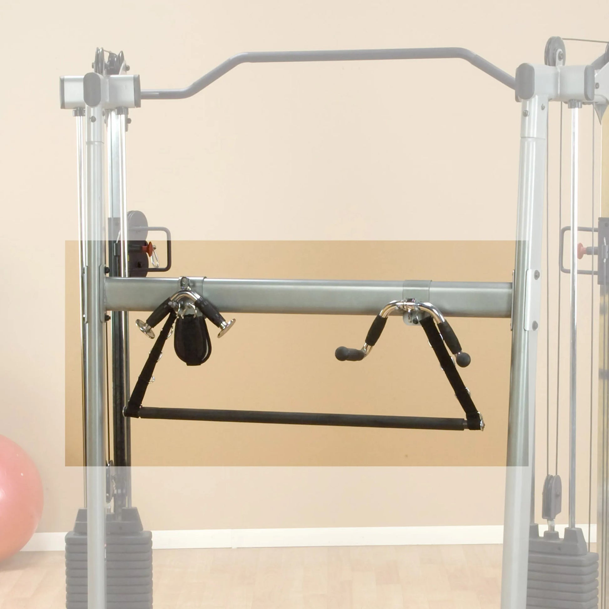 Cable crossover machine with attachments in a home gym setting.
